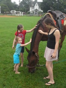 Peyton Avery Morgan petting horse